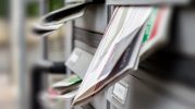 Mail box full of advertising brochures Direct Mail